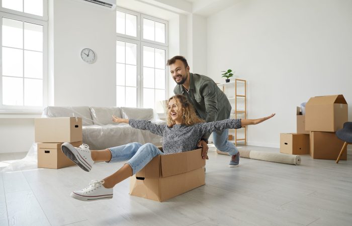 Young,Married,Couple,Having,Fun,On,Moving,Day.,Happy,First