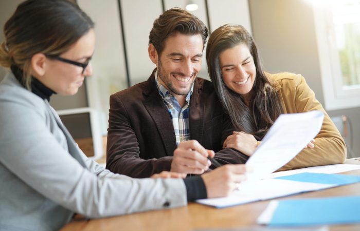 Attractive,Couple,Signing,Sales,Agreement,With,Real,Estate,Agent