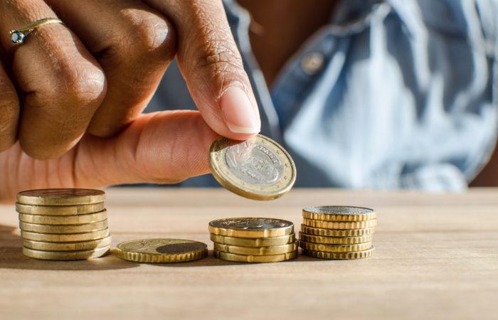 Closeup,Of,A,Black,Woman,Hand,Counting,Euro,Coins,On