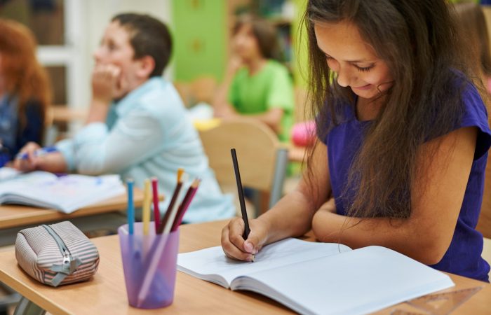 Girl drawing in her notebook