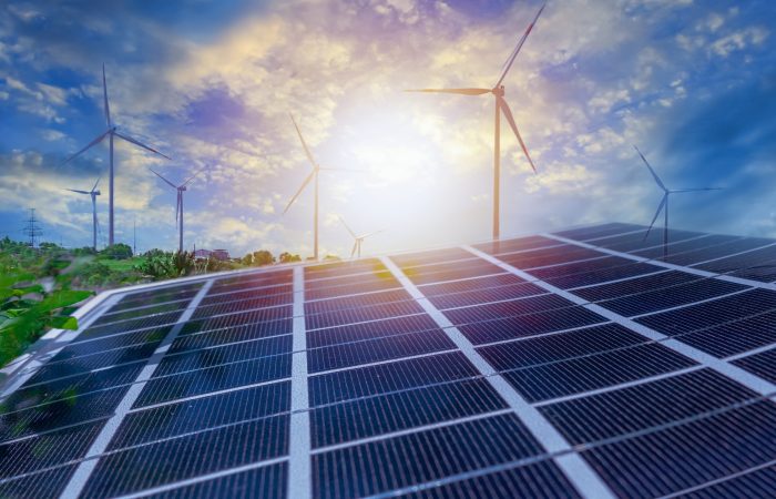 Solar panels and wind power stations. Renewable energy wind and solar generation. Defocused photo with soft focus.