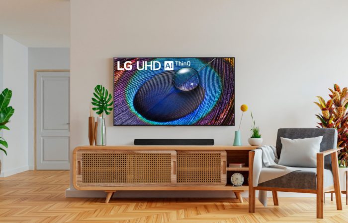 Mock up wall mounted tv with cabinet and armchair on white wall background.3d rendering; Shutterstock ID 2068194953; purchase_order: -; job: -; client: -; other: -