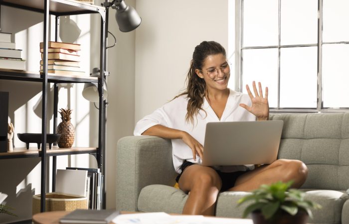 female-sitting-couch-with-laptop