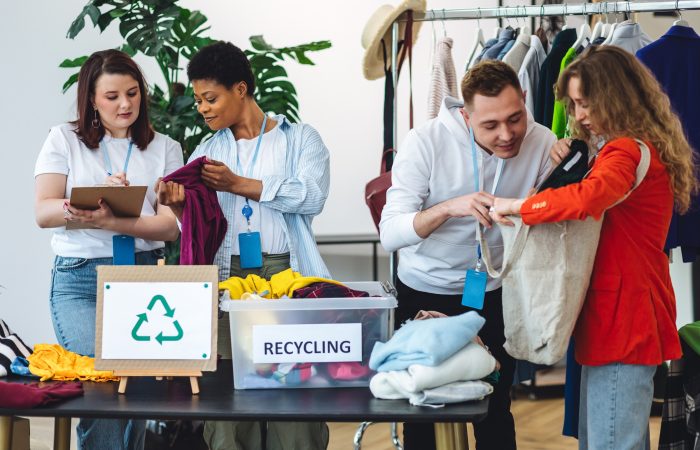 Young,Woman,Brings,Old,Clothes,For,Recycling,,Charity,,Donation.,Eco